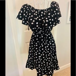 Black and white polka dot on/off shoulder dress.